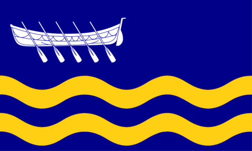 Shows the Saint Anne's-on-the-Sea Flag: a white row boat above two wavy horizontal yellow bars, on blue