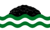 The community flag of Girvan (South Ayrshire) - a central black crag on white above wavy lines of white and green